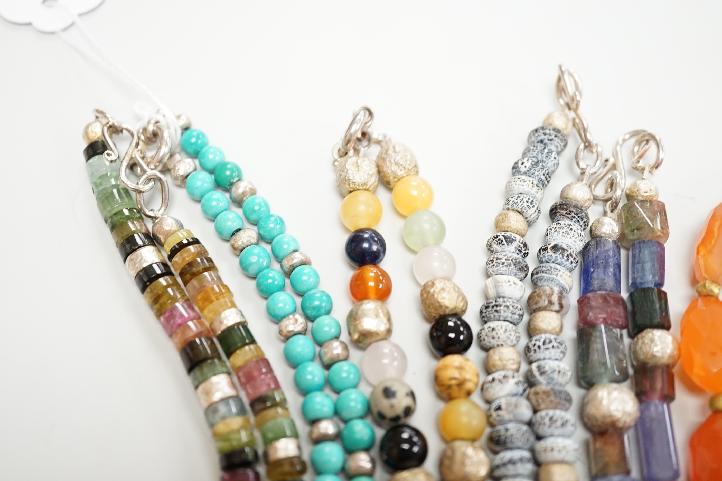 Five assorted Pruden & Smith silver and hardstone necklaces, largest 42cm and three other similar unsigned necklaces.